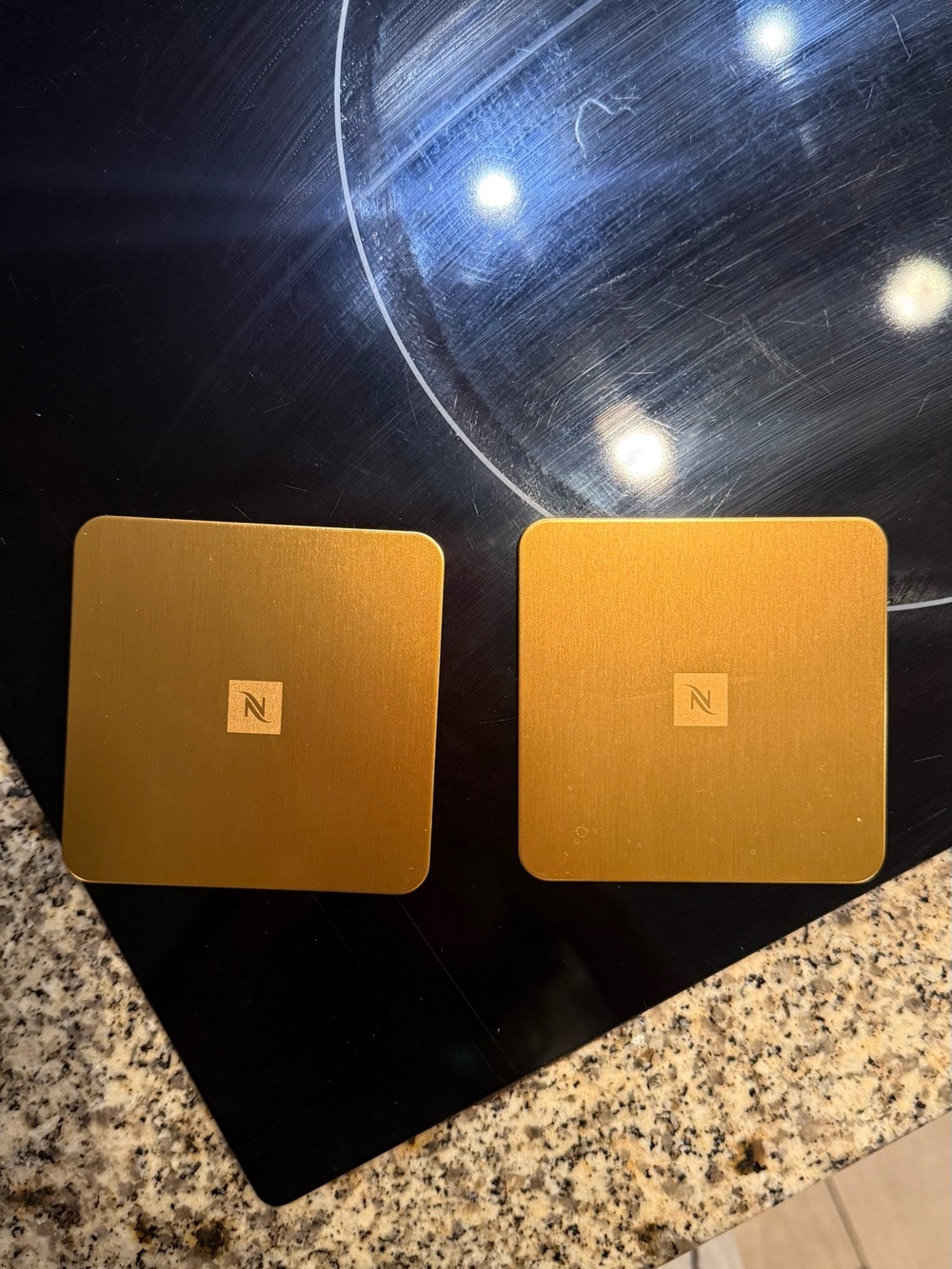 Set of 2 Nespresso gold coasters